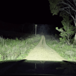 An image showing the beam spread and distance on a dirt track of the Ultra Vision Nitro Maxx 105W Light Bars